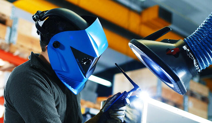 Man wearing PPE while welding 